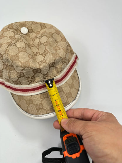 Gucci baseball cap in pink beige with GG monogram pattern and logo.