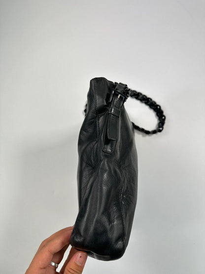 Prada black leather shoulder bag with chain straps from SS99 collection.