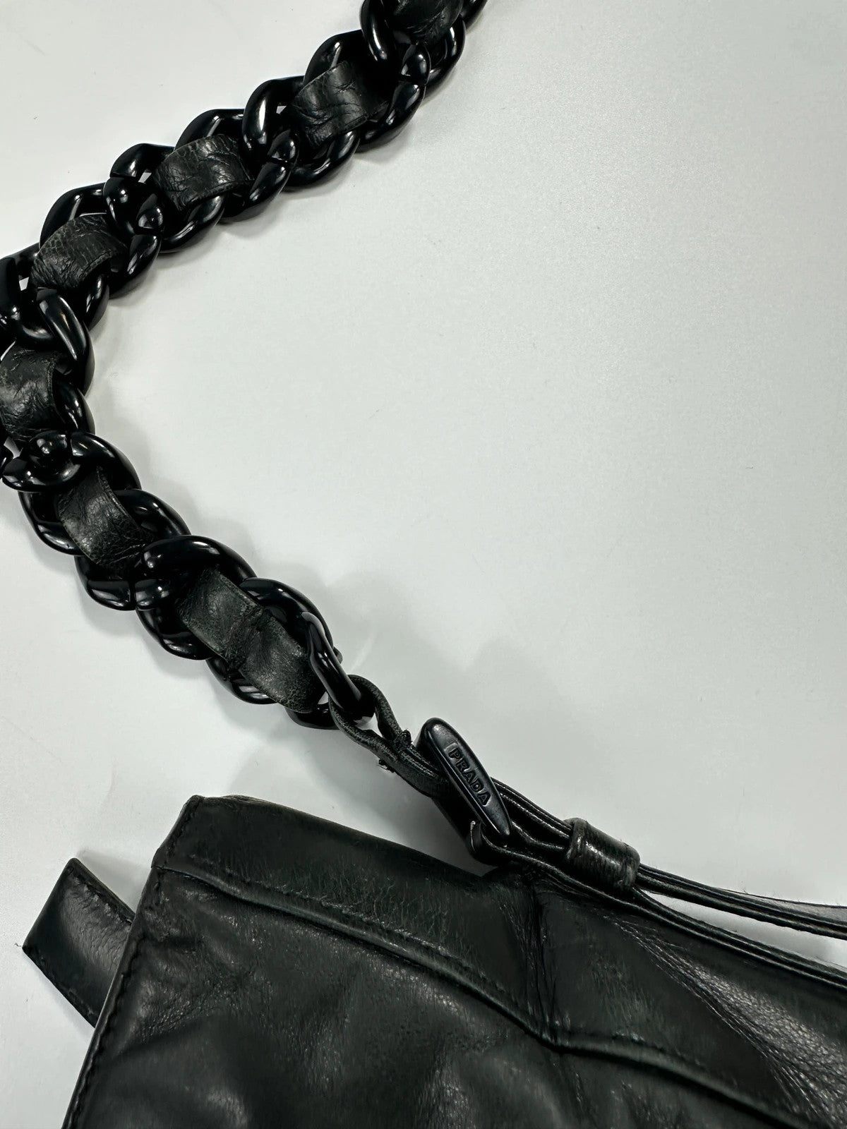 Prada black leather shoulder bag with chain straps from SS99 collection.