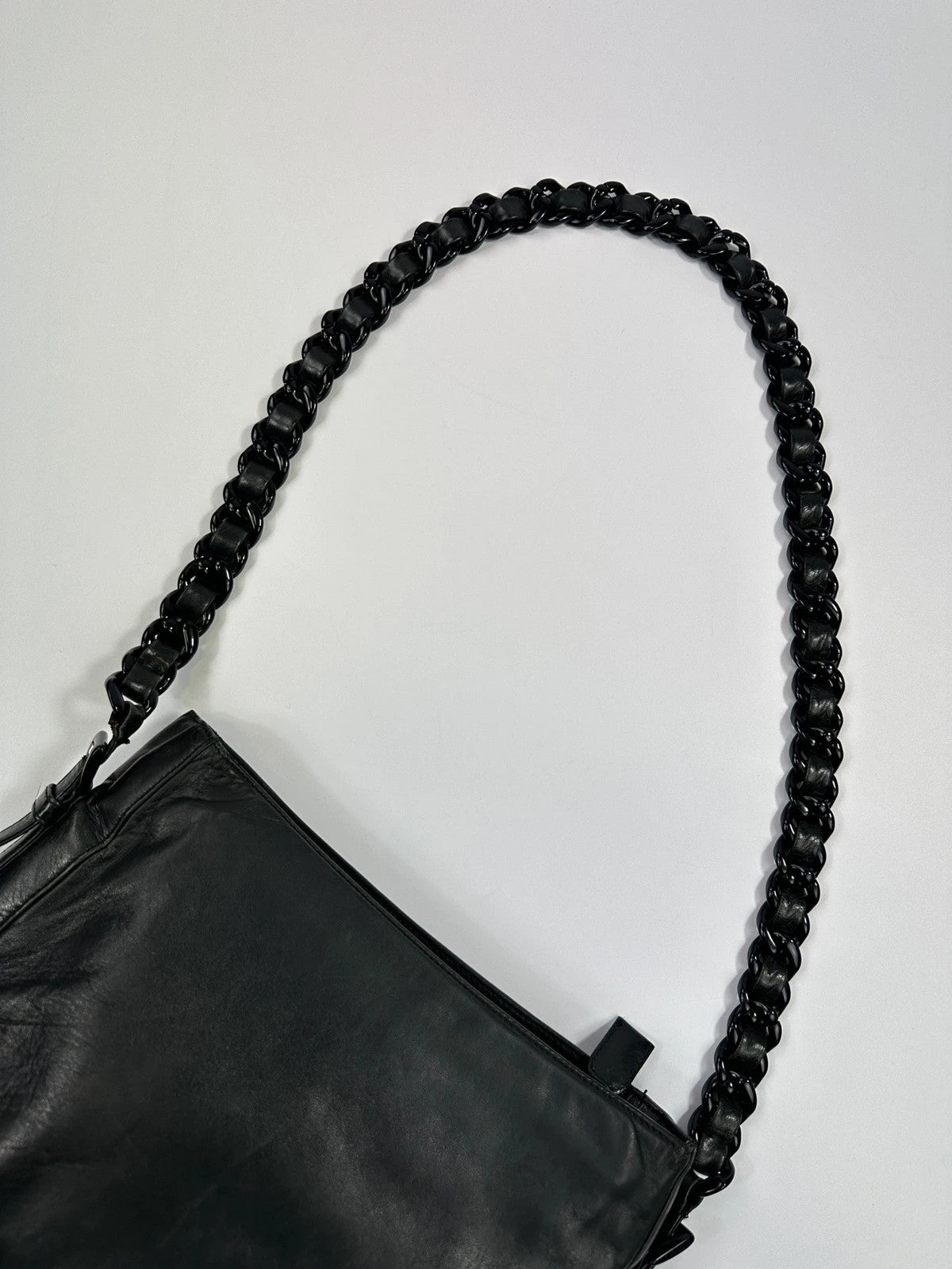 Prada black leather shoulder bag with chain straps from SS99 collection.