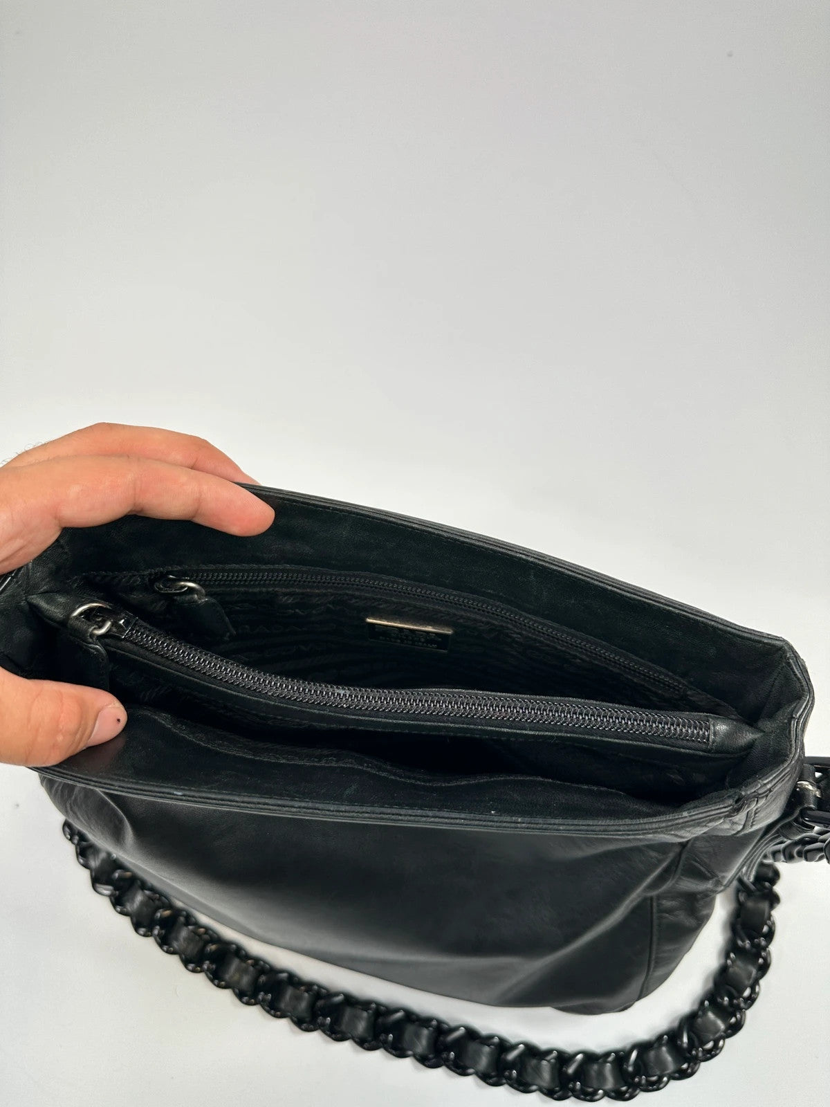 Prada black leather shoulder bag with chain straps from SS99 collection.