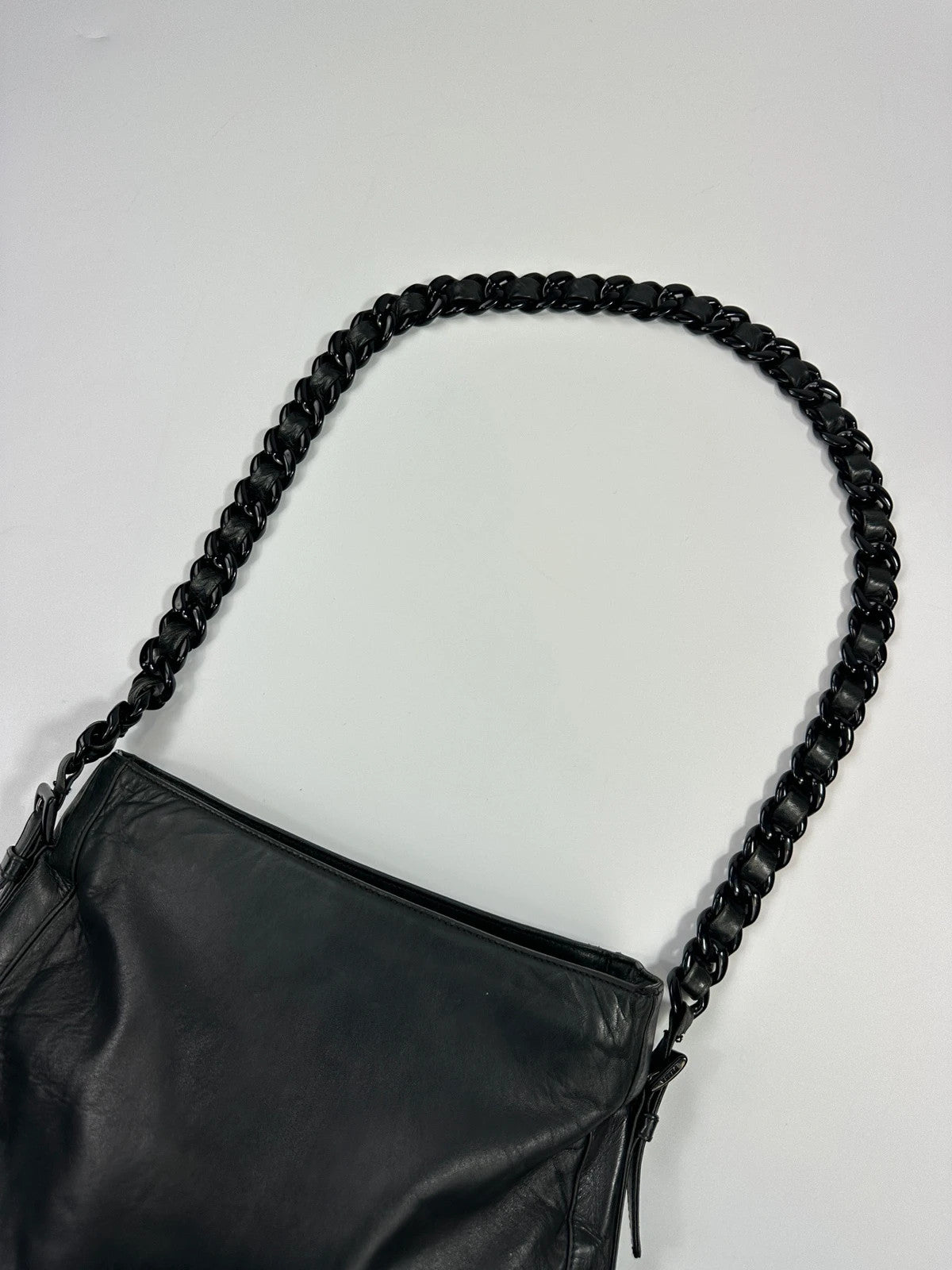 Prada black leather shoulder bag with chain straps from SS99 collection.
