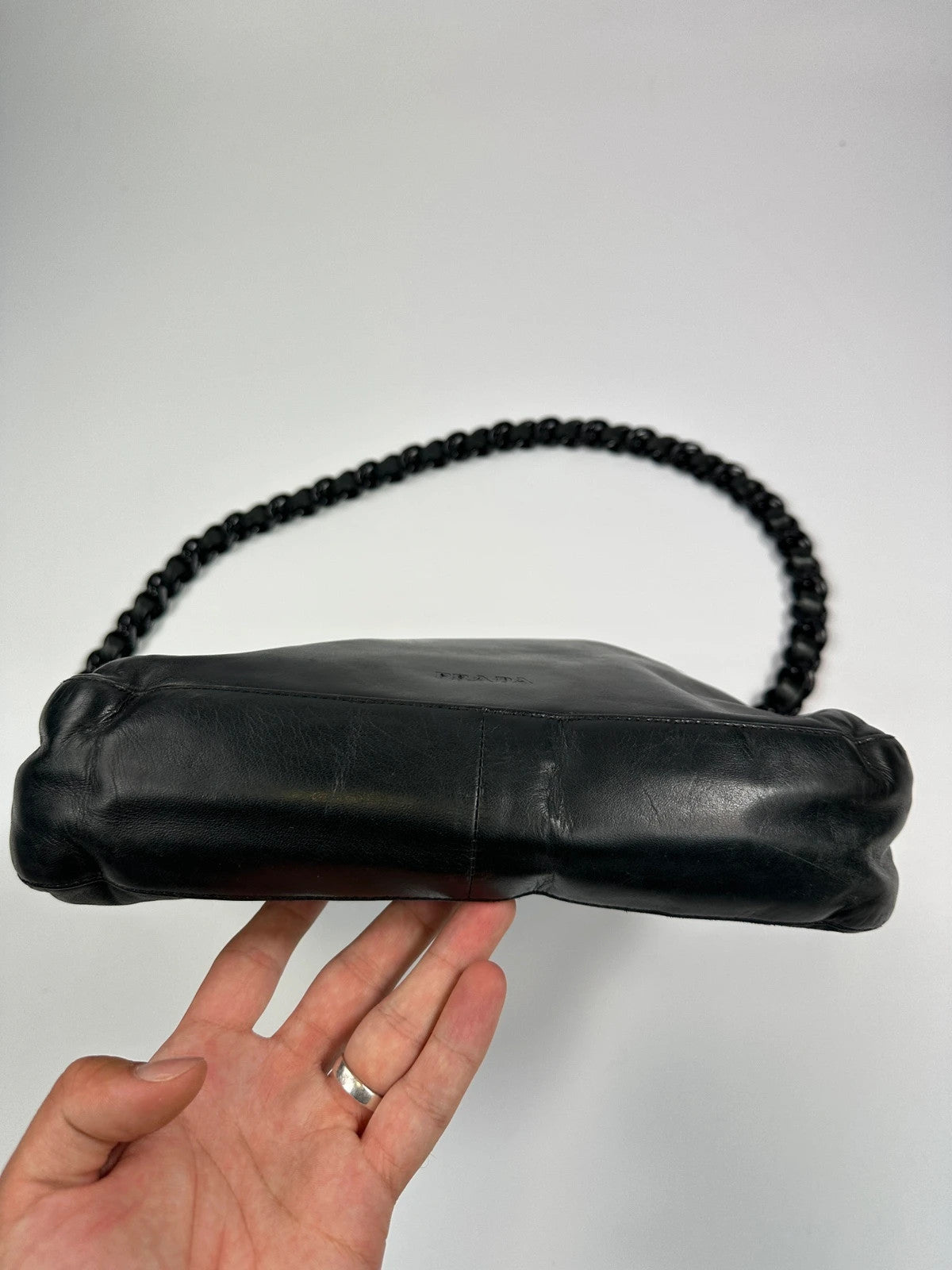Prada black leather shoulder bag with chain straps from SS99 collection.