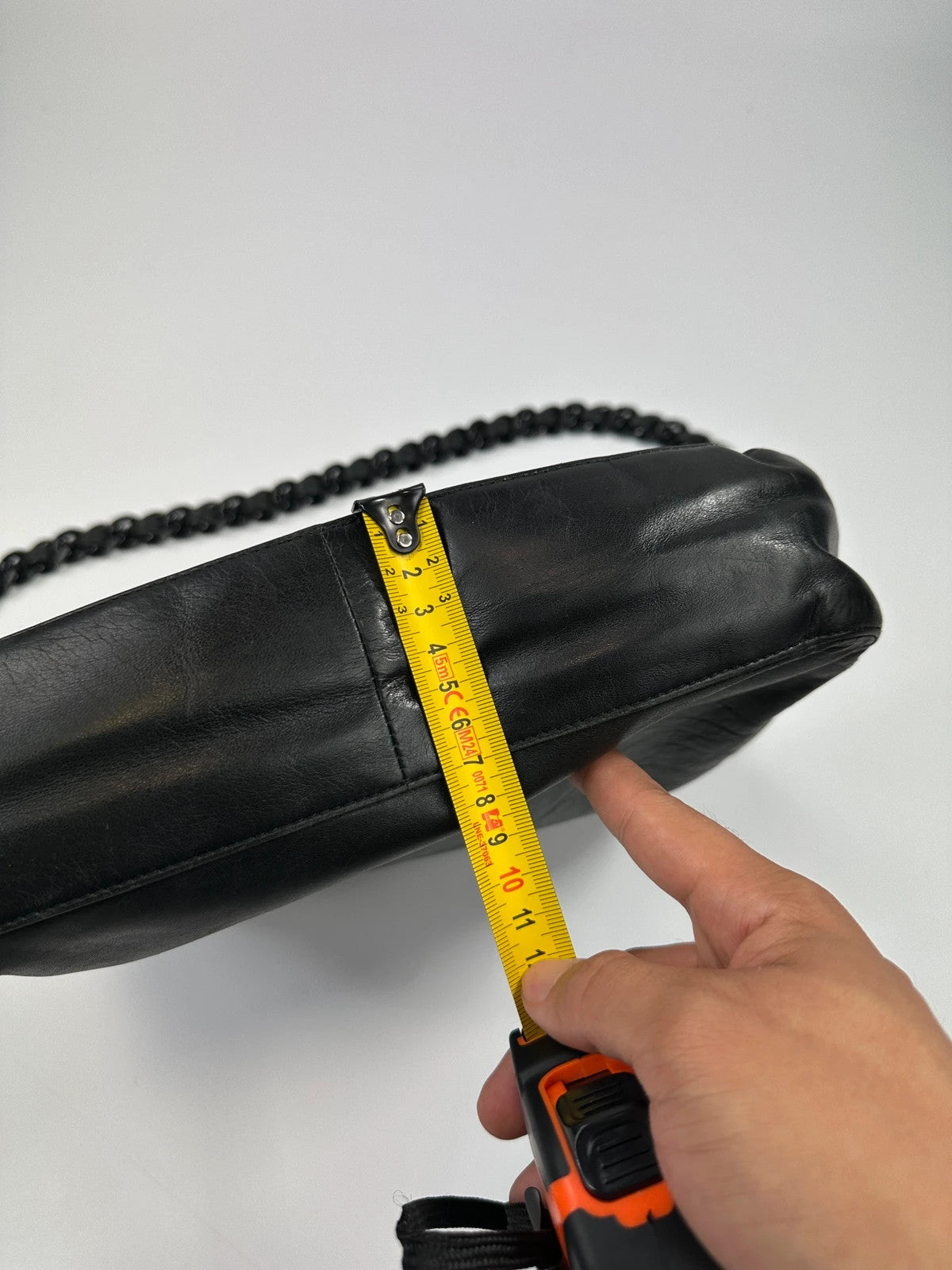 Prada black leather shoulder bag with chain straps from SS99 collection.