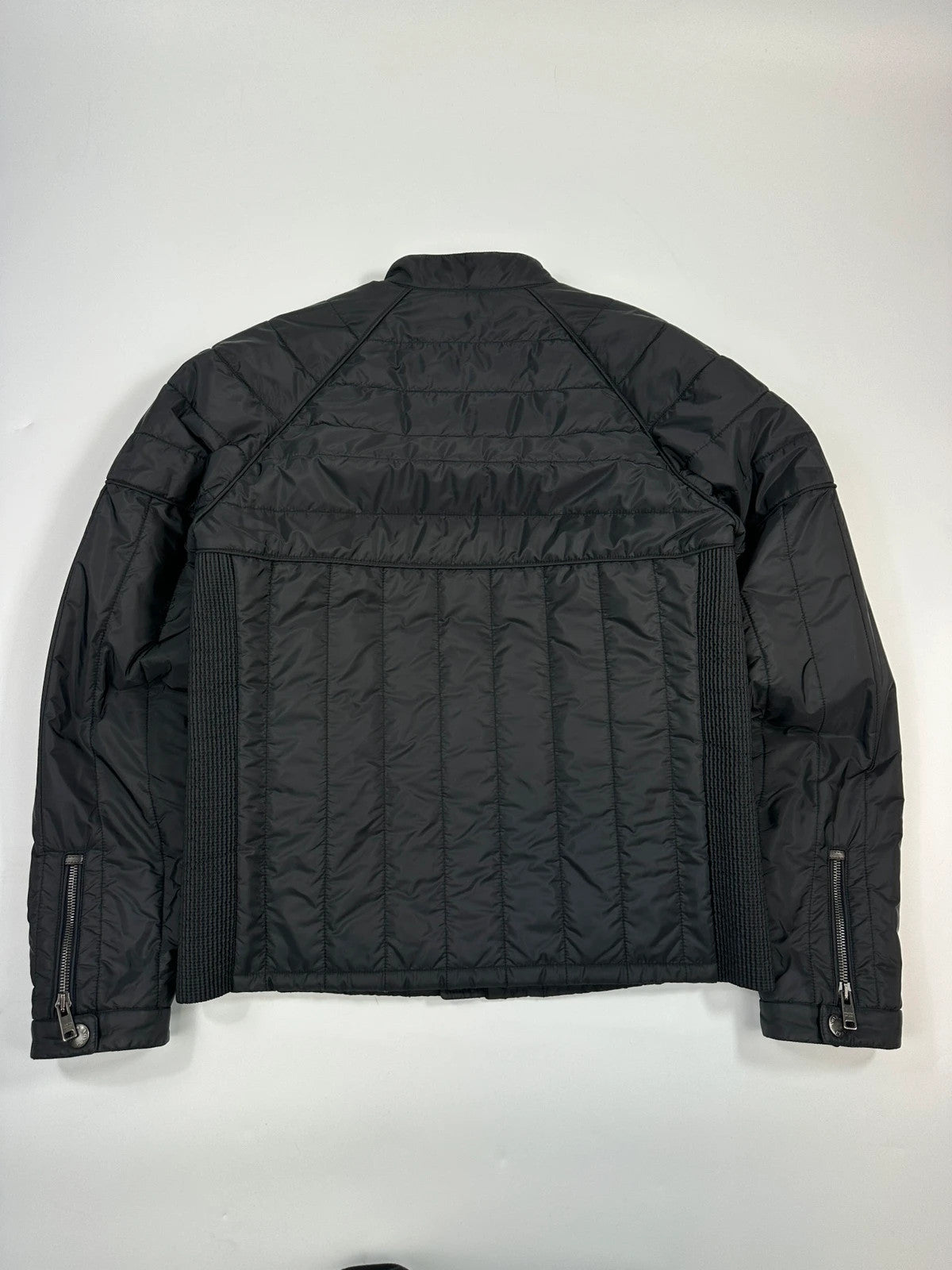 Prada black padded quilted nylon jacket with ribbed side panels and logo detailing.