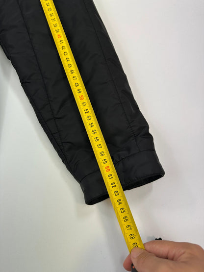 Prada black padded quilted nylon jacket with ribbed side panels and logo detailing.