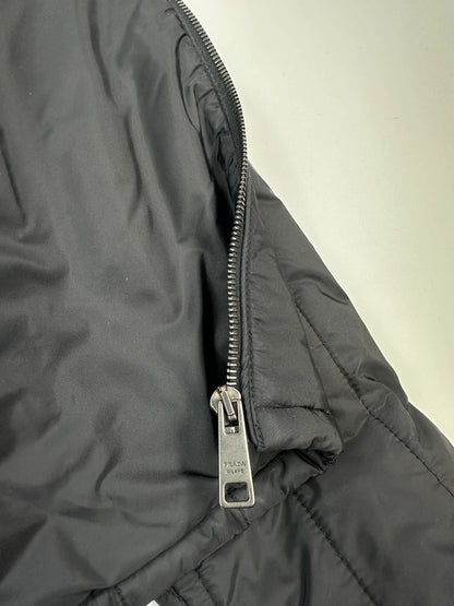 Prada black padded quilted nylon jacket with ribbed side panels and logo detailing.