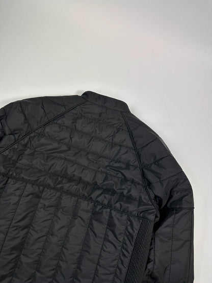 Prada black padded quilted nylon jacket with ribbed side panels and logo detailing.
