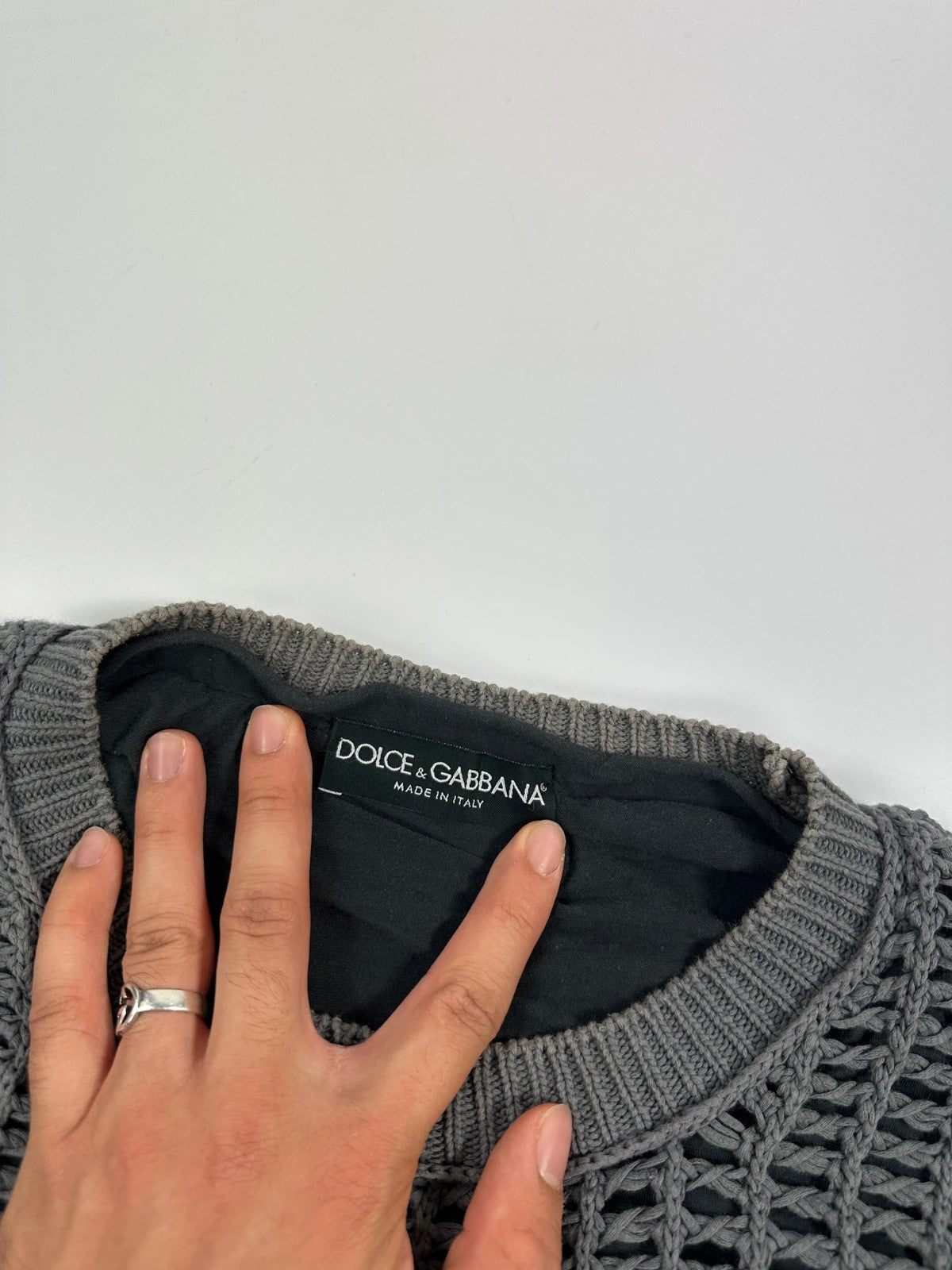 Dolce & Gabbana grey and black mesh knit sweater with layered t-shirt design.