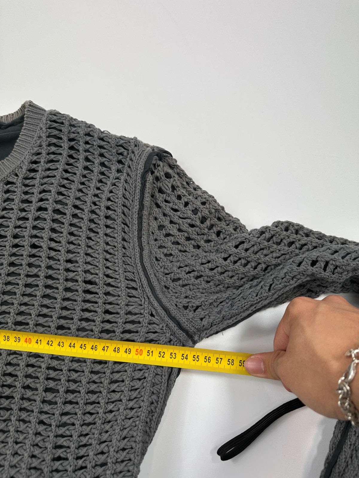 Dolce & Gabbana grey and black mesh knit sweater with layered t-shirt design.