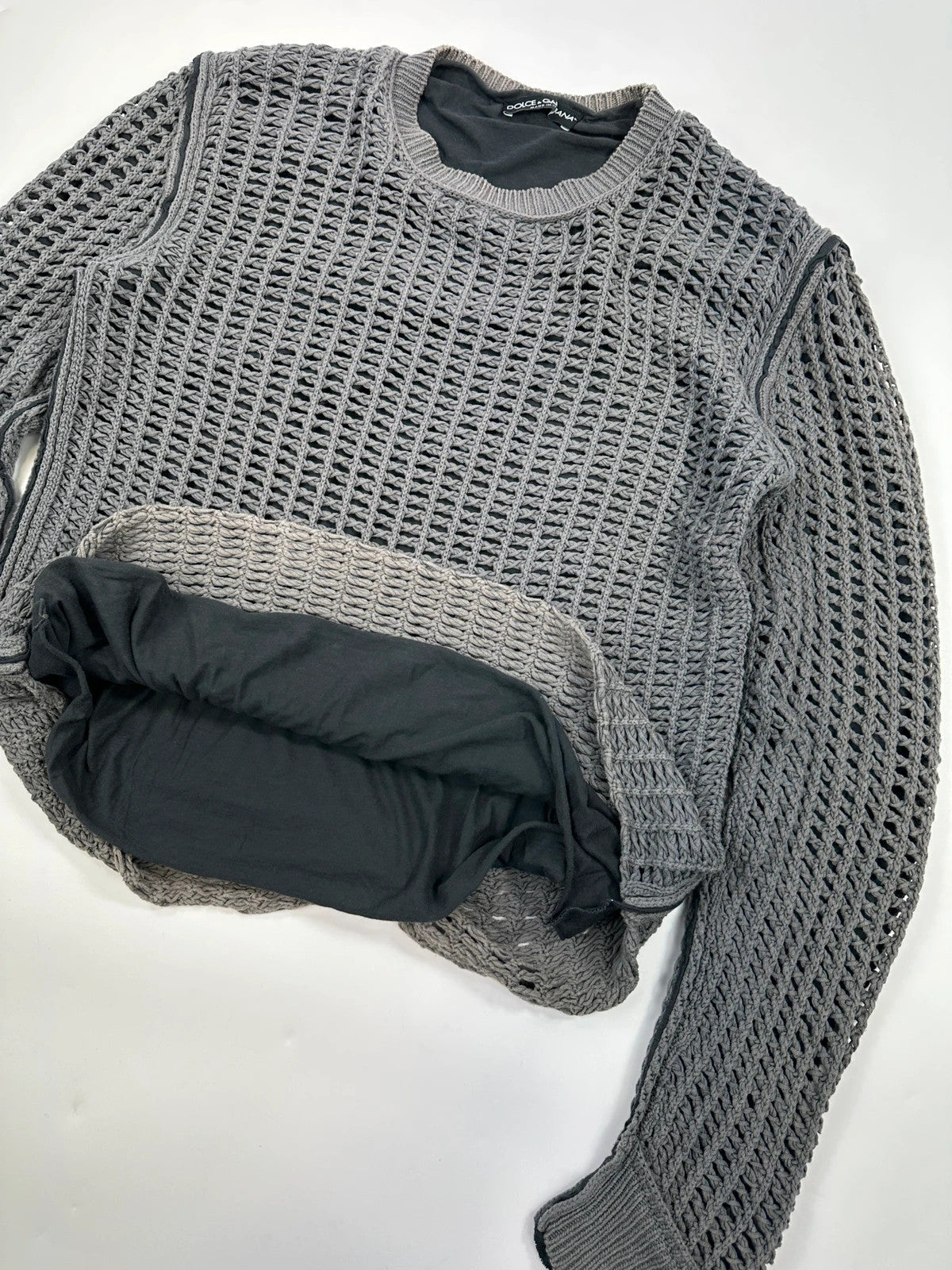 Dolce & Gabbana grey and black mesh knit sweater with layered t-shirt design.