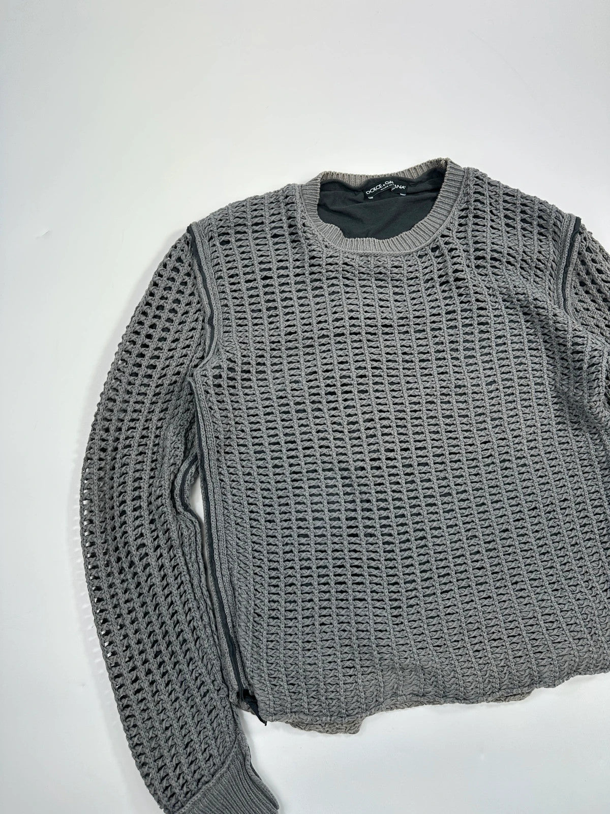Dolce & Gabbana grey and black mesh knit sweater with layered t-shirt design.