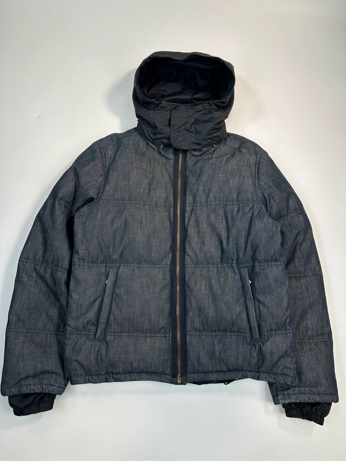 Prada blue hybrid down puffer jacket with removable hood and denim material.