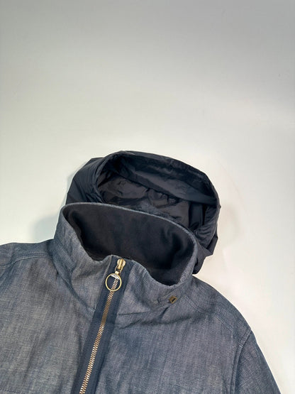 Prada blue hybrid down puffer jacket with removable hood and denim material.