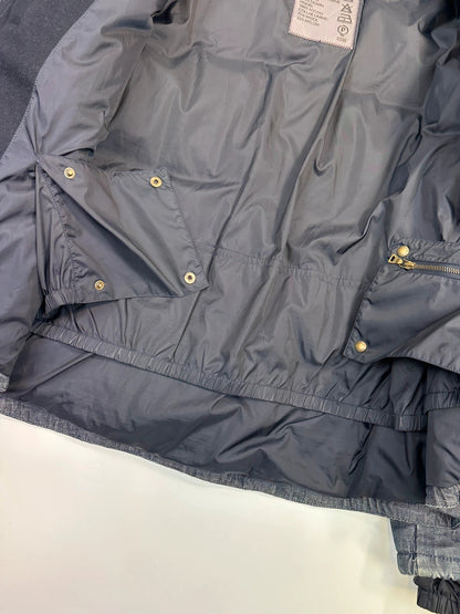 Prada blue hybrid down puffer jacket with removable hood and denim material.