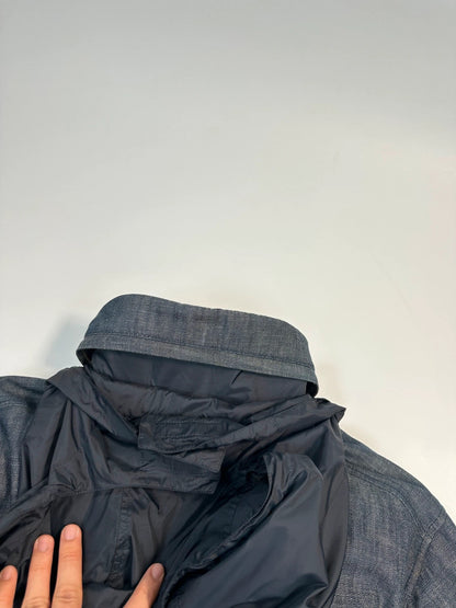 Prada blue hybrid down puffer jacket with removable hood and denim material.