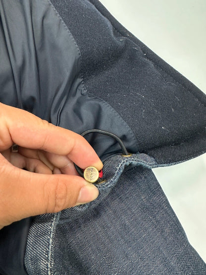 Prada blue hybrid down puffer jacket with removable hood and denim material.