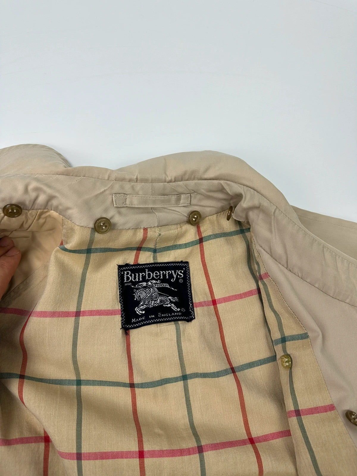Burberrys beige trench coat jacket double breasted with removable lining and classic logo.