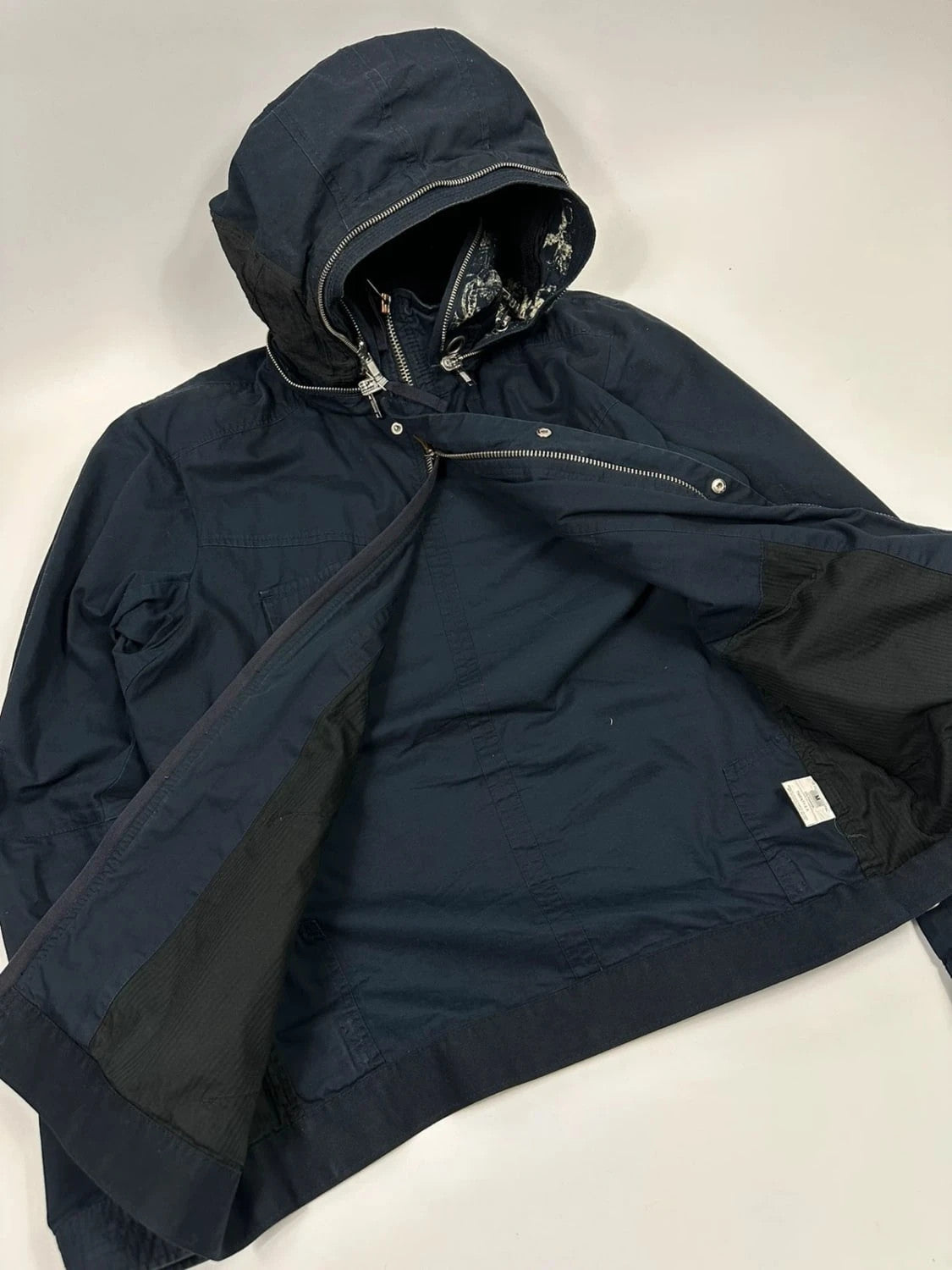 Marithé Francois Girbaud navy multi-pocket jacket adjustable fit packable design.