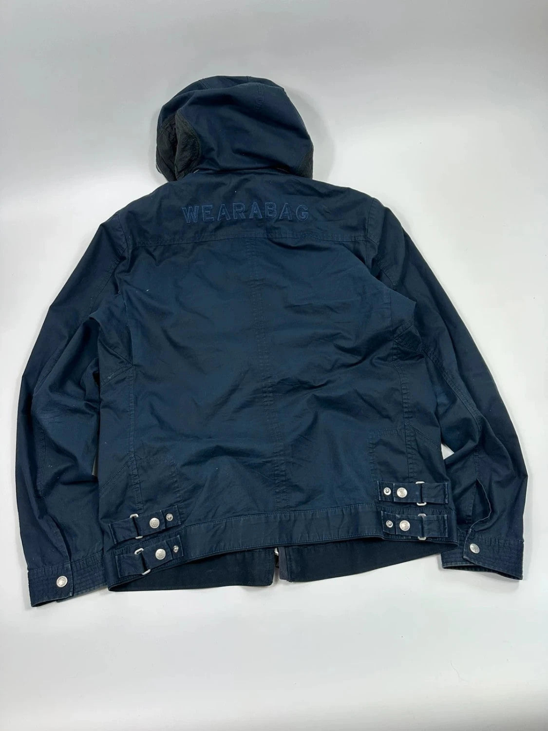 Marithé Francois Girbaud navy multi-pocket jacket adjustable fit packable design.