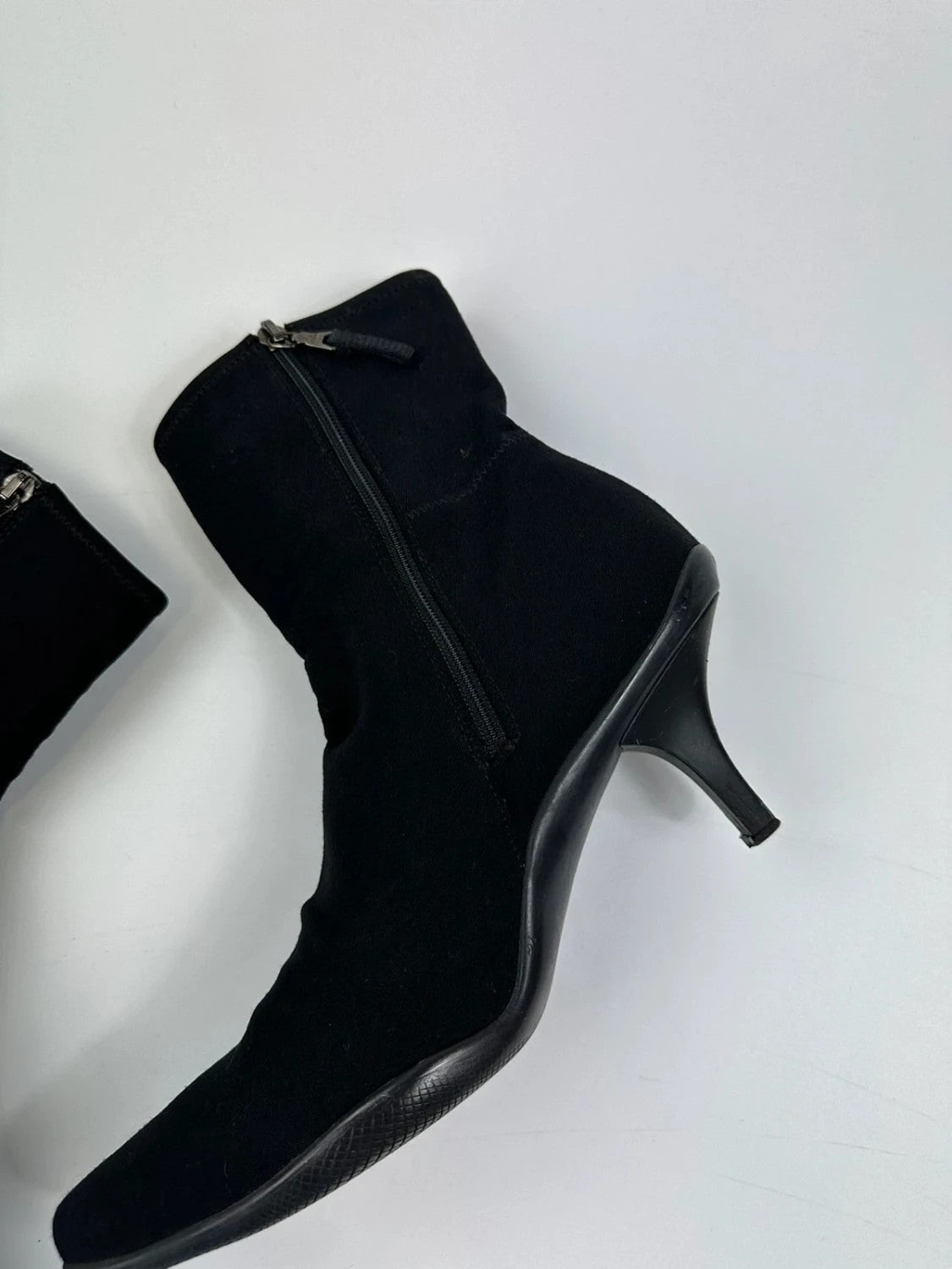 Prada black neoprene boots with pointed toe and leather interior.