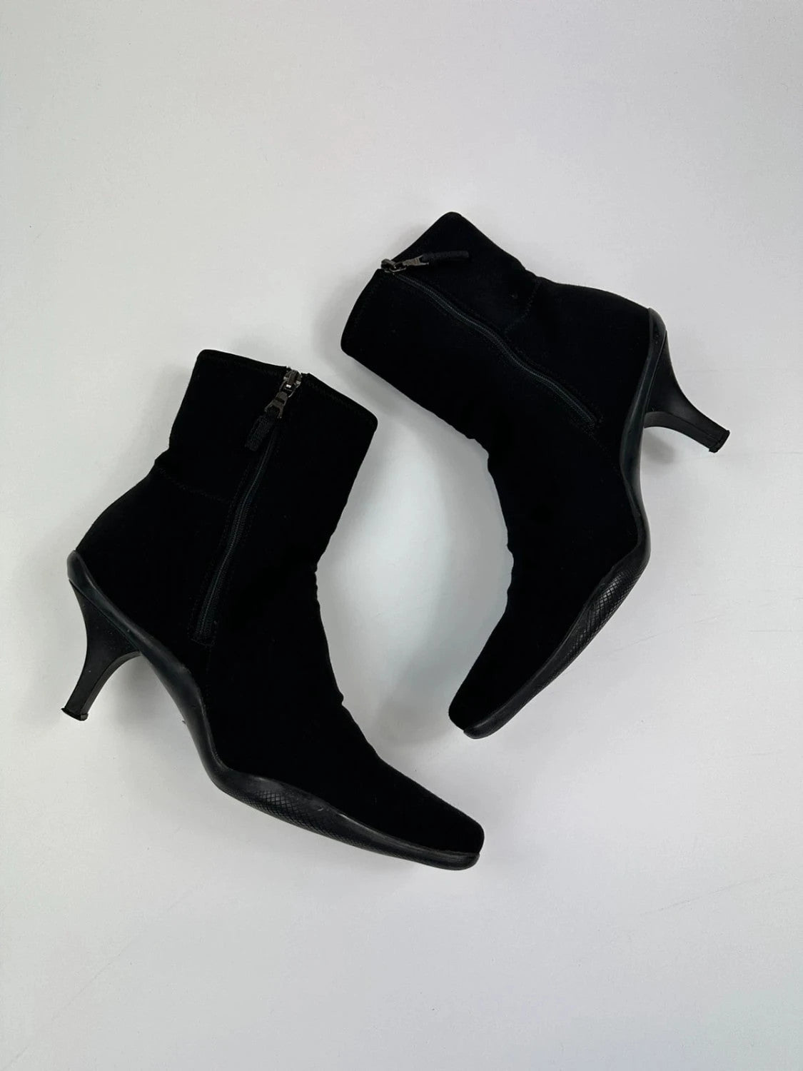 Prada black neoprene boots with pointed toe and leather interior.
