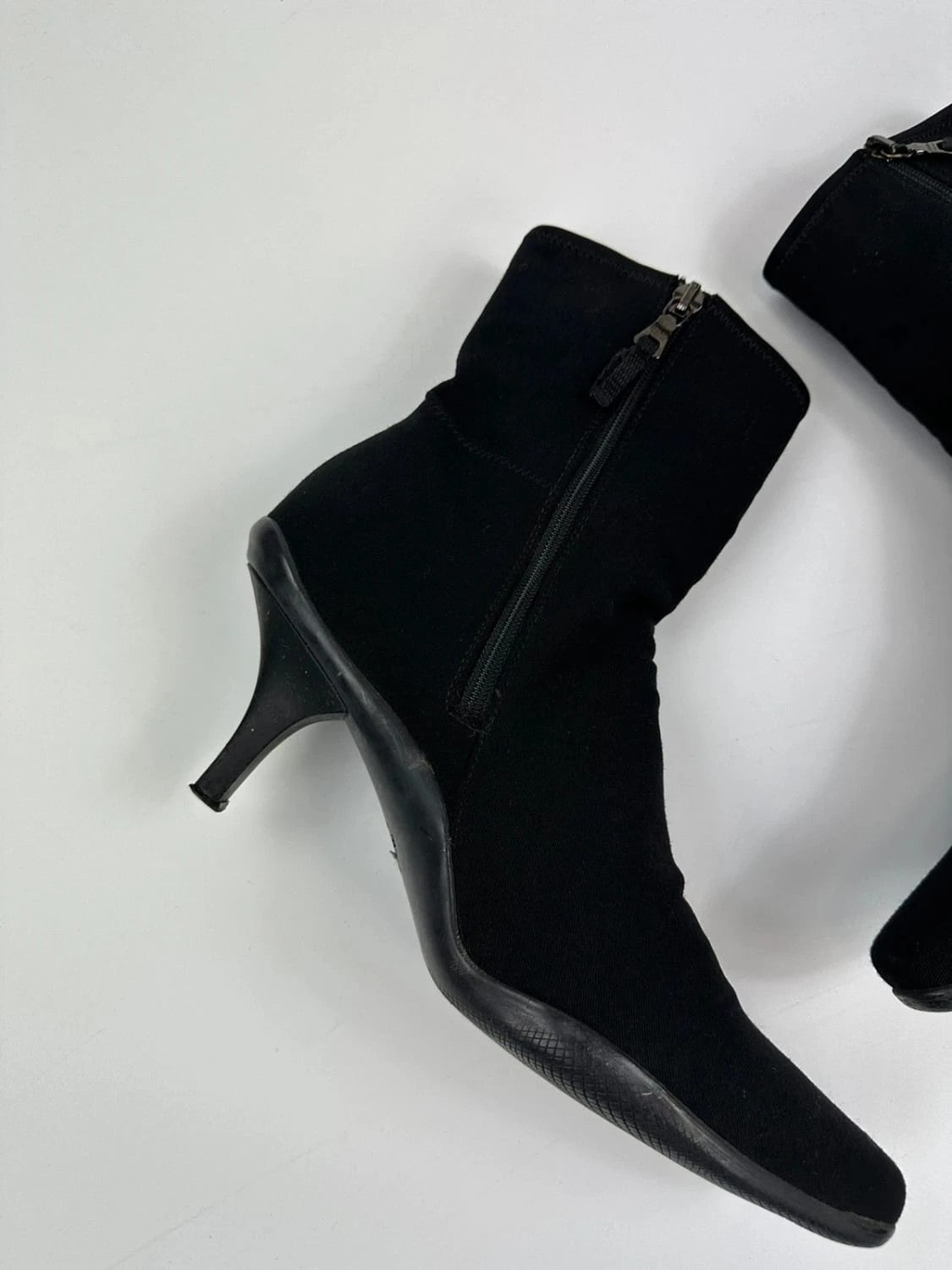 Prada black neoprene boots with pointed toe and leather interior.