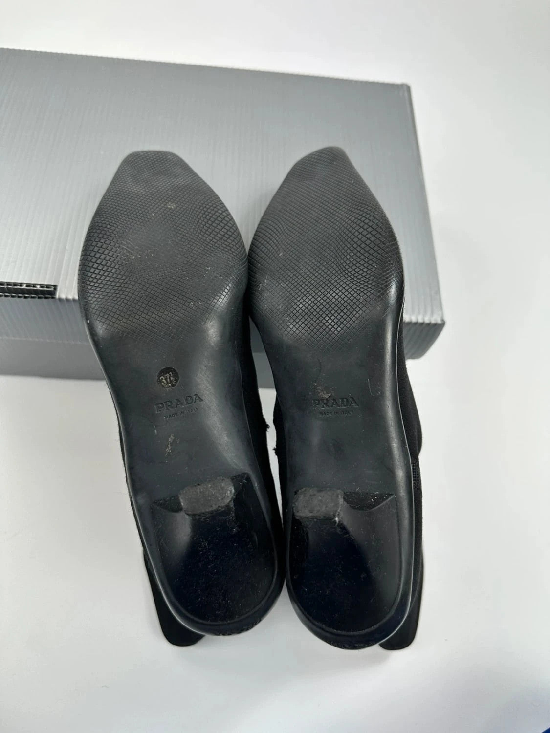 Prada black neoprene boots with pointed toe and leather interior.