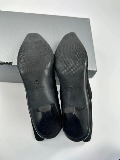 Prada black neoprene boots with pointed toe and leather interior.