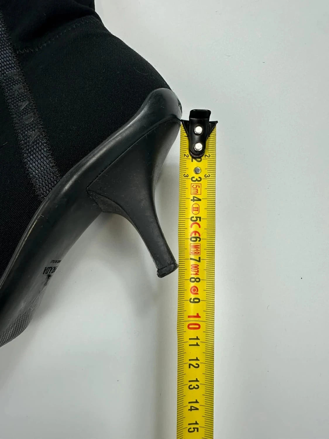 Prada black neoprene boots with pointed toe and leather interior.
