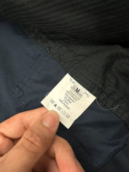 Marithé Francois Girbaud navy multi-pocket jacket adjustable fit packable design.
