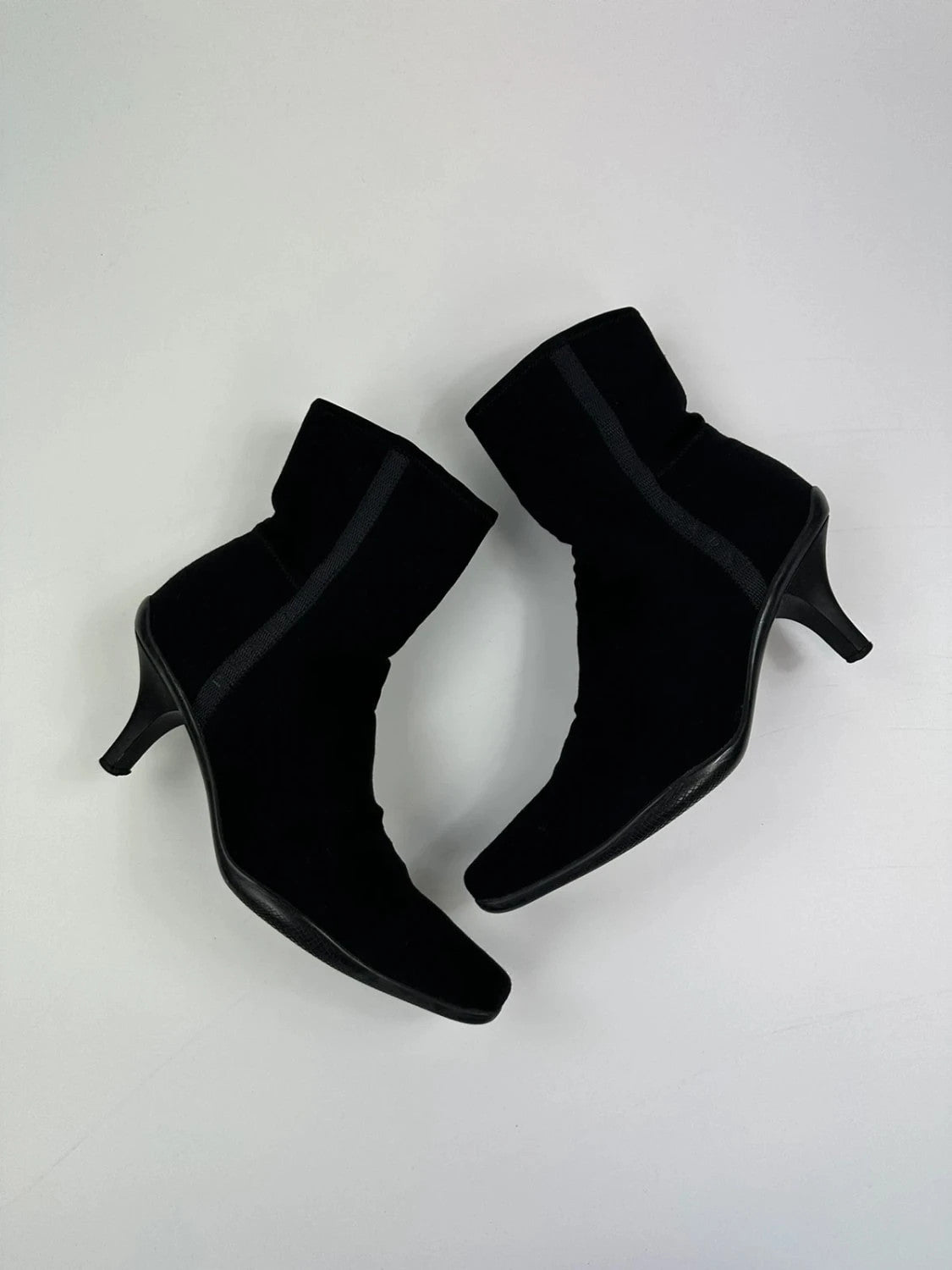 Prada black neoprene boots with pointed toe and leather interior.