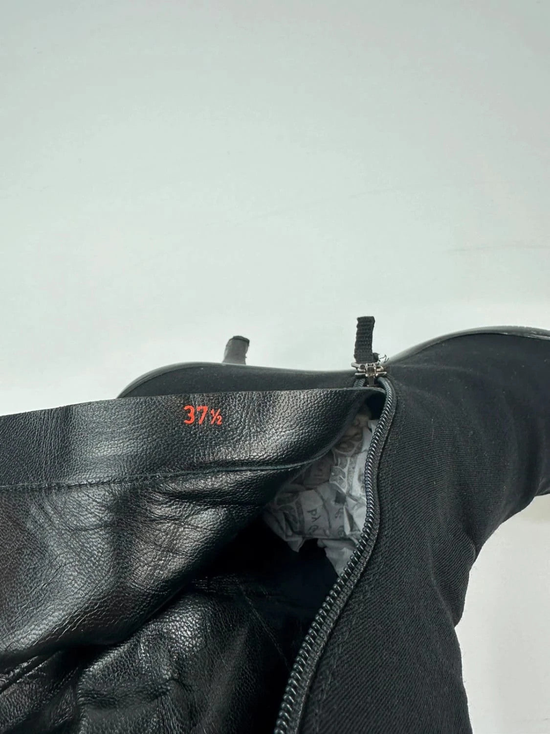 Prada black neoprene boots with pointed toe and leather interior.
