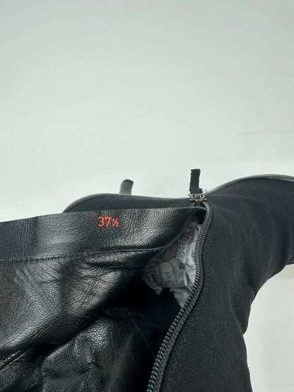 Prada black neoprene boots with pointed toe and leather interior.