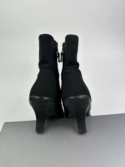 Prada black neoprene boots with pointed toe and leather interior.