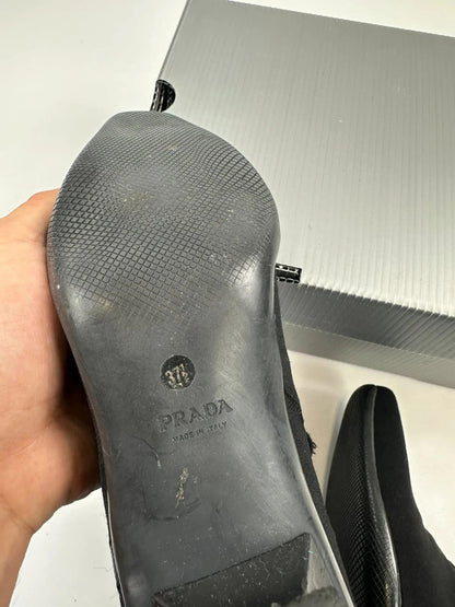 Prada black neoprene boots with pointed toe and leather interior.
