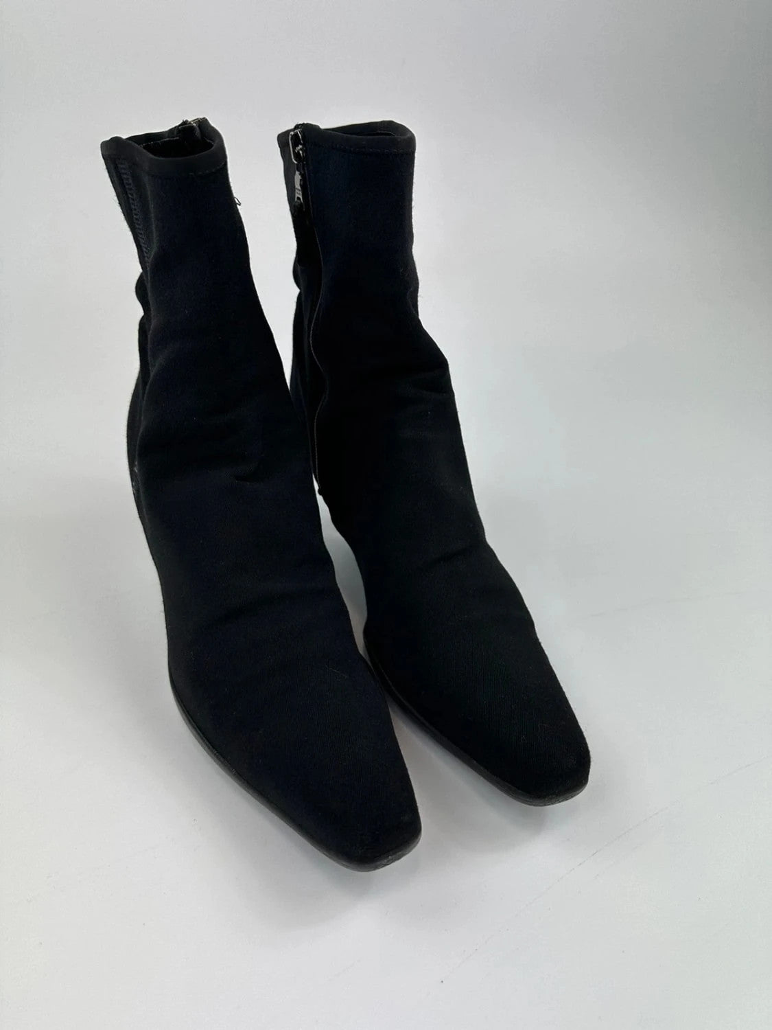 Prada black neoprene boots with pointed toe and leather interior.