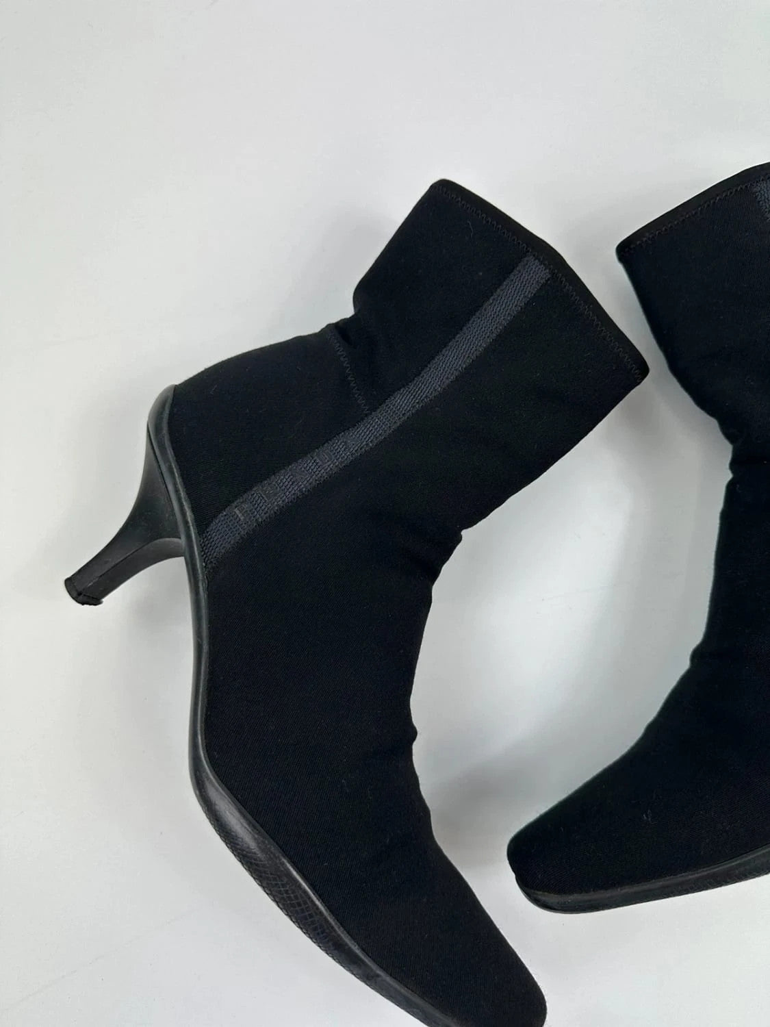Prada black neoprene boots with pointed toe and leather interior.