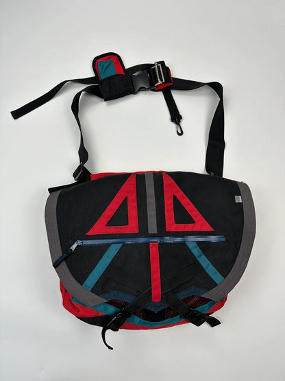 Marithé François Girbaud red and black messenger bag with mesh pocket and logo details.