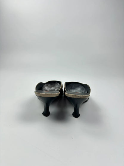 Miu Miu beige and red leather mules with kitten heels and minimalist design.