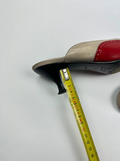 Miu Miu beige and red leather mules with kitten heels and minimalist design.