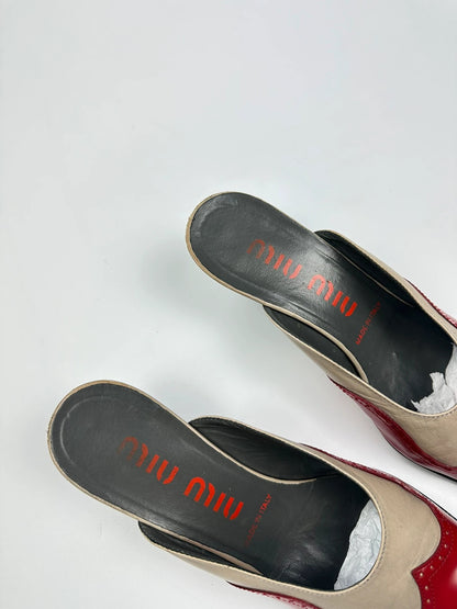 Miu Miu beige and red leather mules with kitten heels and minimalist design.