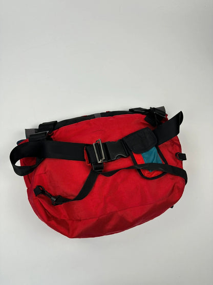 Marithé François Girbaud red and black messenger bag with mesh pocket and logo details.