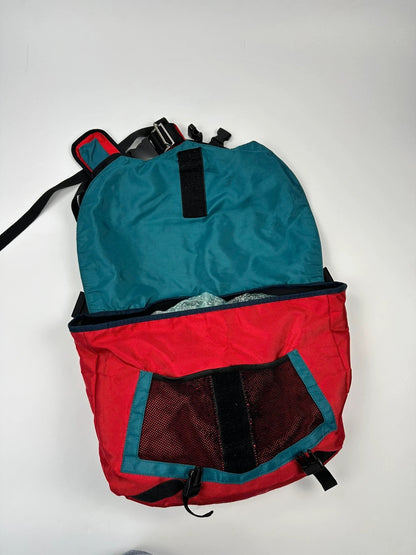 Marithé François Girbaud red and black messenger bag with mesh pocket and logo details.