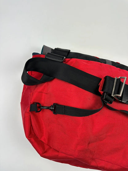Marithé François Girbaud red and black messenger bag with mesh pocket and logo details.