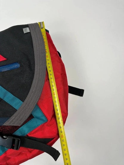 Marithé François Girbaud red and black messenger bag with mesh pocket and logo details.