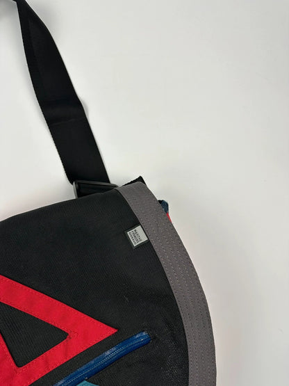 Marithé François Girbaud red and black messenger bag with mesh pocket and logo details.