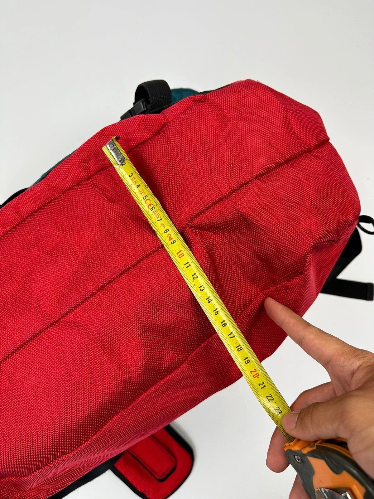 Marithé François Girbaud red and black messenger bag with mesh pocket and logo details.