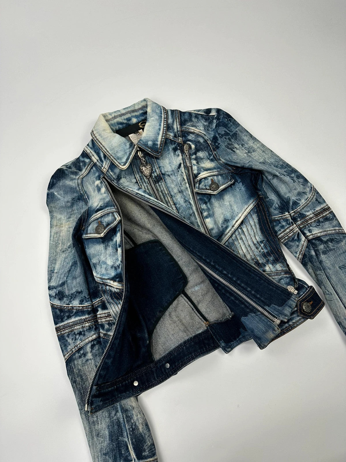 Just Cavalli sky blue denim jacket with multiple zippers and unique print design.