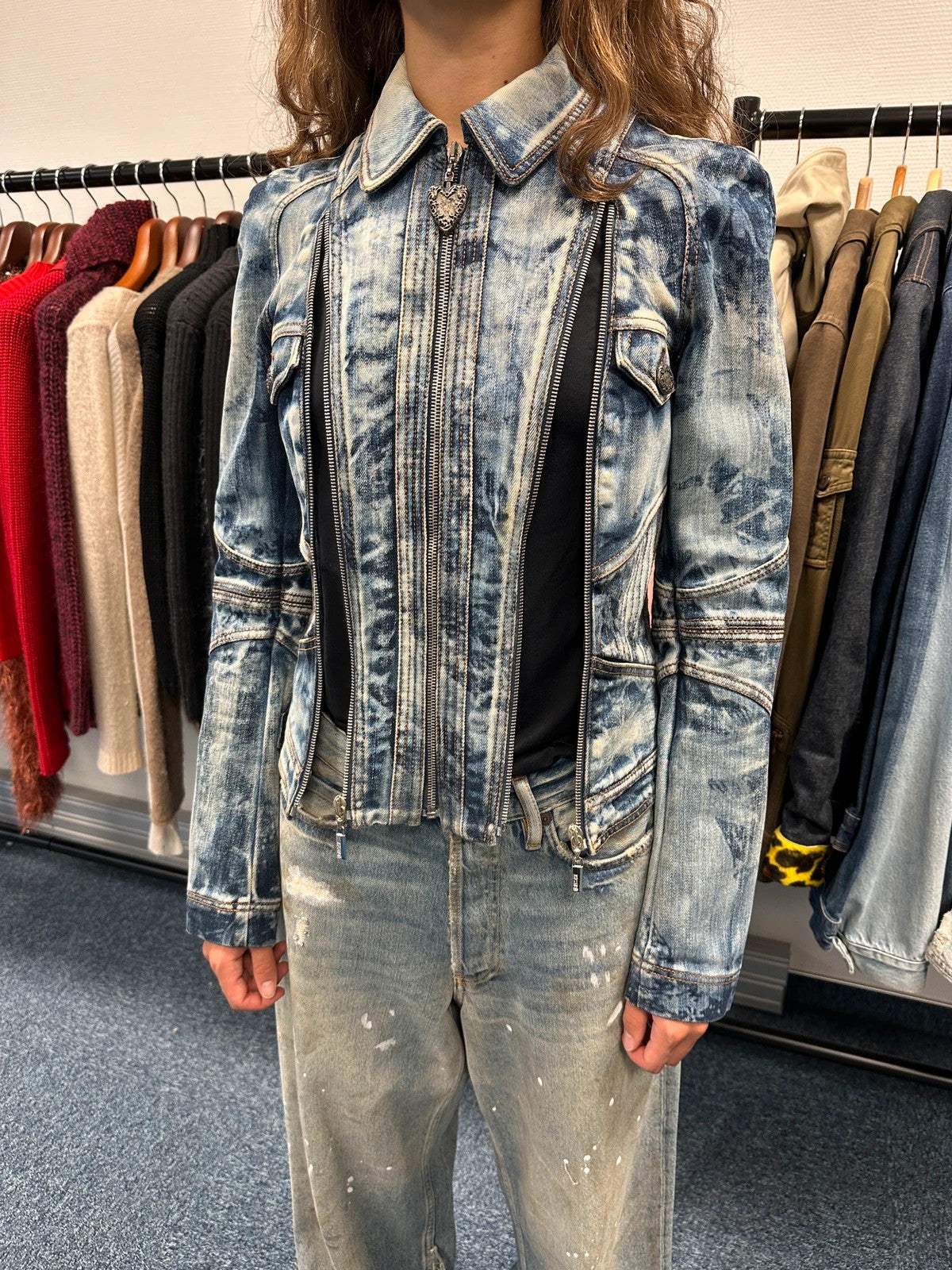Just Cavalli sky blue denim jacket with multiple zippers and unique print design.